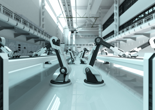 Robot arms working along a conveyor in an automated production line.