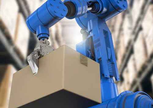 A picking robot lifting a cardboard carton in a warehouse.